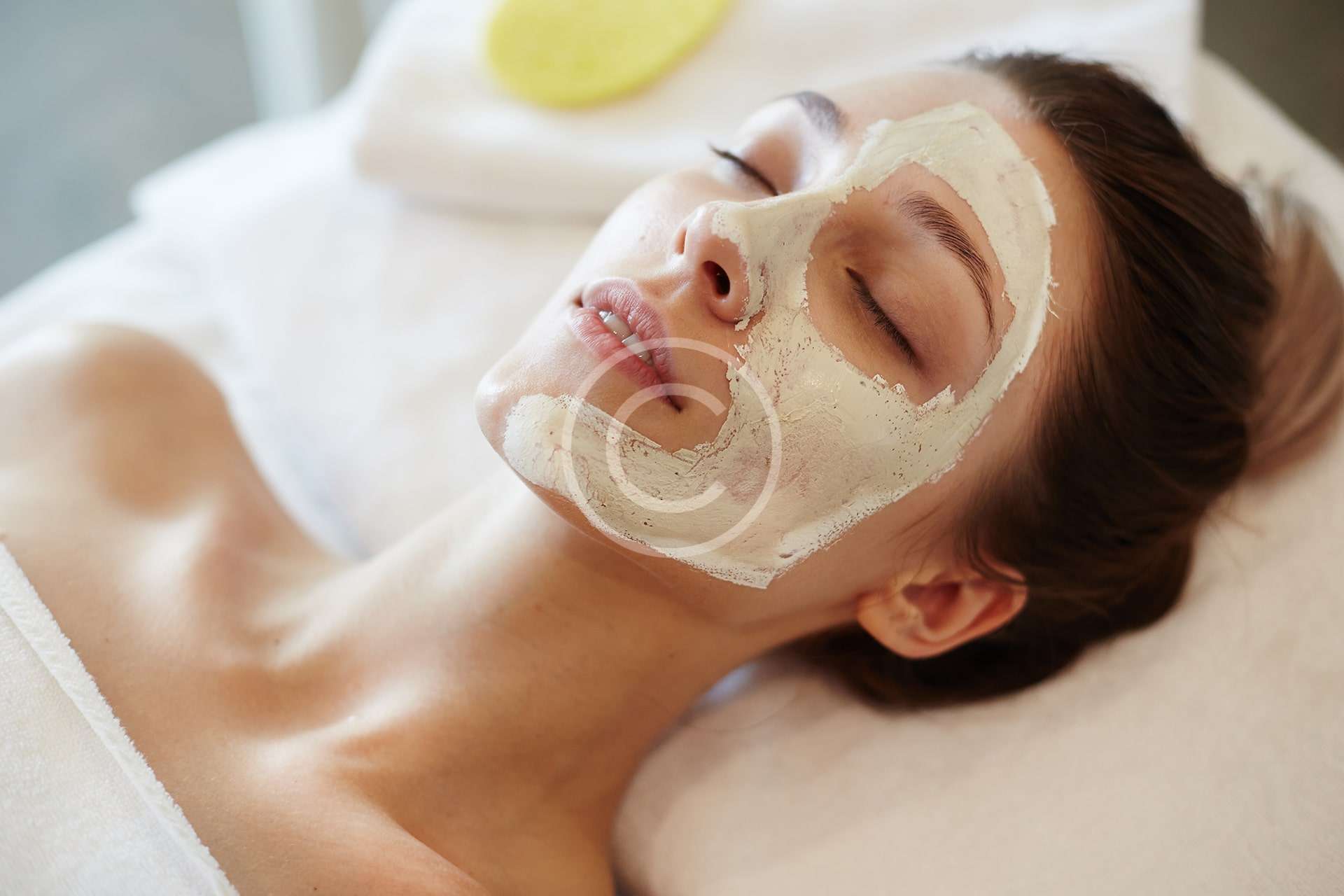 A woman sleeping with a mask on her face