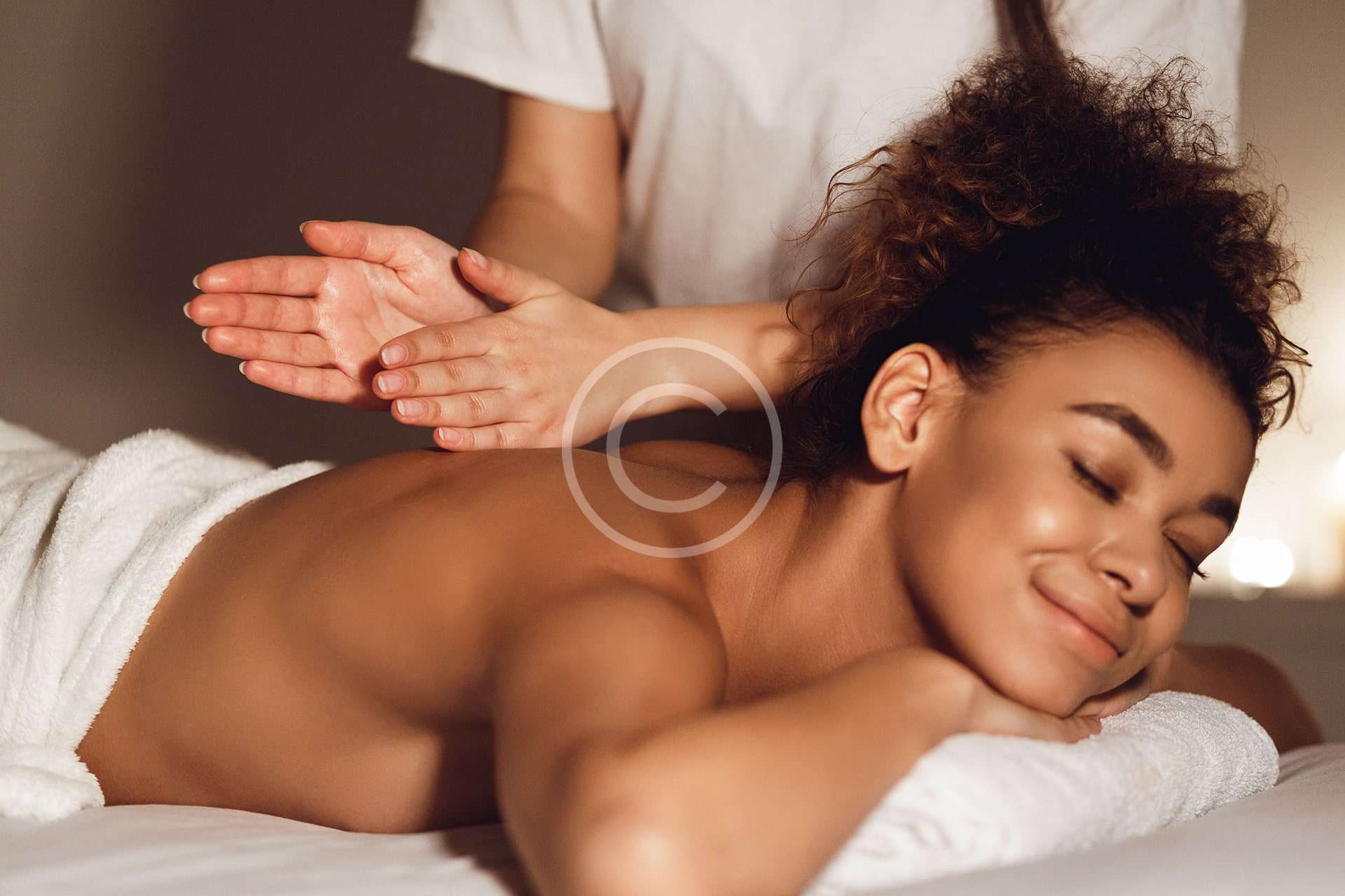 A woman enjoying a back massage